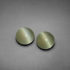 Actinolite Cat's Eye طبيعي بلون أخضر، وزن ‎‎ قيراط، شكل دائري، مقاس ‎7.01‎ مم