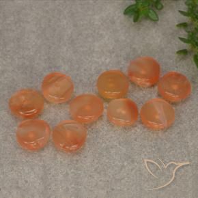 أحجار كارنيليان برتقالى مشمشى دافئ طبيعية، شكل خيالي، نصف شفاف، وزنها 6.11 قيراط