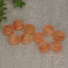 أحجار كارنيليان برتقالى مشمشى دافئ طبيعية، شكل خيالي، نصف شفاف، وزنها 6.11 قيراط