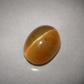 Cat's Eye Apatite طبيعي بلون عسلي، وزن ‎3.94‎ قيراط، شكل شفاف، مقاس ‎9.8x7.4‎ مم