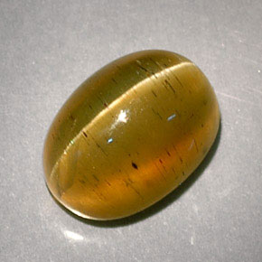 Cat's Eye Apatite طبيعي بلون عسلي، وزن ‎3.32‎ قيراط، شكل بيضاوى، مقاس ‎9.2x6.8‎ مم