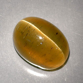 Cat's Eye Apatite طبيعي بلون عسلي، وزن ‎3.32‎ قيراط، شكل بيضاوى، مقاس ‎9.2x6.8‎ مم