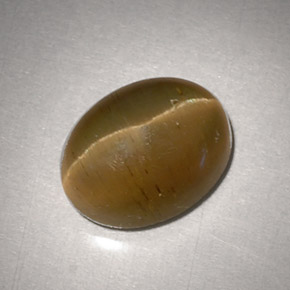 Cat's Eye Apatite طبيعي بلون ذهبي مخضر، وزن ‎3.11‎ قيراط، شكل بيضاوى، مقاس ‎9.2x7.1‎ مم