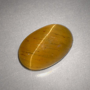 Cat's Eye Apatite طبيعي بلون ذهبي مخضر، وزن ‎2.48‎ قيراط، شكل بيضاوى، مقاس ‎9.5x6.2‎ مم