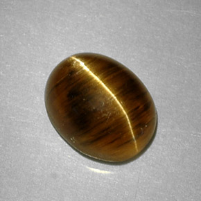 Cat's Eye Apatite طبيعي بلون عسلي، وزن ‎2.64‎ قيراط، شكل بيضاوى، مقاس ‎8.8x7‎ مم