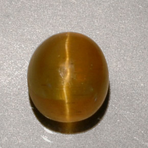 Cat's Eye Apatite طبيعي بلون عسلي، وزن ‎1.90‎ قيراط، شكل بيضاوى، مقاس ‎6.9x6.2‎ مم