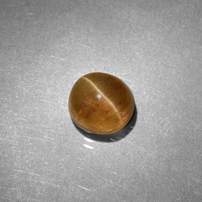 Cat's Eye Apatite طبيعي بلون عسلي، وزن ‎1.61‎ قيراط، شكل بيضاوى، مقاس ‎6.2x5.7‎ مم