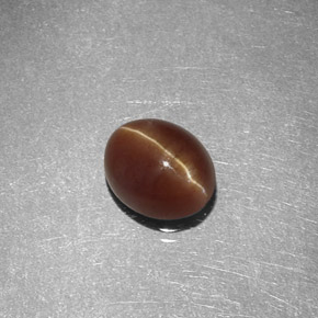 Cat's Eye Apatite طبيعي بلون عسلي، وزن ‎1.47‎ قيراط، شكل بيضاوى، مقاس ‎7x5.7‎ مم