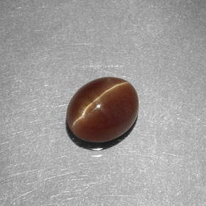 Cat's Eye Apatite طبيعي بلون عسلي، وزن ‎1.47‎ قيراط، شكل بيضاوى، مقاس ‎7x5.7‎ مم