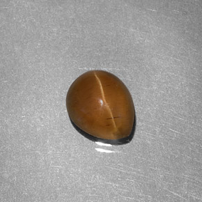 Cat's Eye Apatite طبيعي بلون عسلي، وزن ‎1.46‎ قيراط، شكل شكل الكمثرى، مقاس ‎7.3x6‎ مم