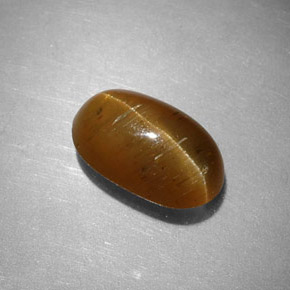 Cat's Eye Apatite طبيعي بلون عسلي، وزن ‎2.44‎ قيراط، شكل بيضاوى، مقاس ‎9.7x5.9‎ مم