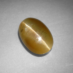 Cat's Eye Apatite طبيعي بلون عسلي، وزن ‎2.77‎ قيراط، شكل بيضاوى، مقاس ‎10.5x7.3‎ مم