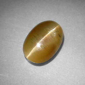 Cat's Eye Apatite طبيعي بلون عسلي، وزن ‎2.77‎ قيراط، شكل بيضاوى، مقاس ‎10.5x7.3‎ مم