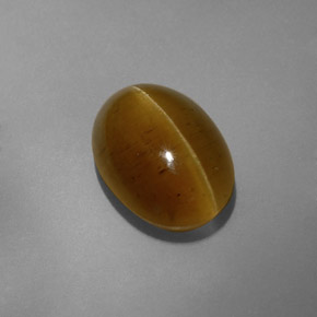 Cat's Eye Apatite طبيعي بلون ذهبي مخضر، وزن ‎8.32‎ قيراط، شكل شفاف، مقاس ‎14x10.1‎ مم