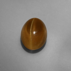 Cat's Eye Apatite طبيعي بلون ذهبي مخضر، وزن ‎7.75‎ قيراط، شكل شفاف، مقاس ‎12.1x9‎ مم
