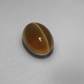 Cat's Eye Apatite طبيعي بلون ذهبي مخضر، وزن ‎6.55‎ قيراط، شكل شفاف، مقاس ‎11.8x8.9‎ مم