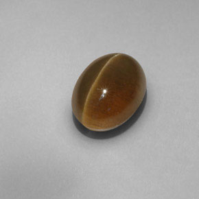Cat's Eye Apatite طبيعي بلون ذهبي مخضر، وزن ‎6.55‎ قيراط، شكل شفاف، مقاس ‎11.8x8.9‎ مم