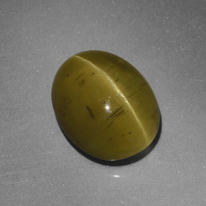 Cat's Eye Apatite طبيعي بلون أخضر ذهبي، وزن ‎5.25‎ قيراط، شكل بيضاوى، مقاس ‎11.2x9‎ مم