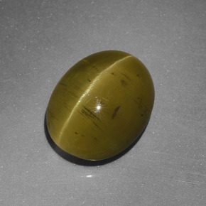 Cat's Eye Apatite طبيعي بلون أخضر ذهبي، وزن ‎5.25‎ قيراط، شكل بيضاوى، مقاس ‎11.2x9‎ مم