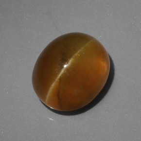 أباتيت عين القط أخضر ذهبى طبيعي، قصة بيضاوى، 4.62 قيراط، نصف شفاف