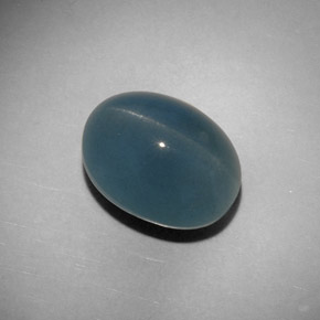 Cat's Eye Aquamarine طبيعي بلون أزرق-أخضر، وزن ‎11.25‎ قيراط، شكل بيضاوى، مقاس ‎14.4x11.1‎ مم