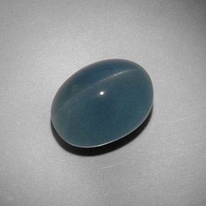 Cat's Eye Aquamarine طبيعي بلون أزرق-أخضر، وزن ‎11.25‎ قيراط، شكل بيضاوى، مقاس ‎14.4x11.1‎ مم