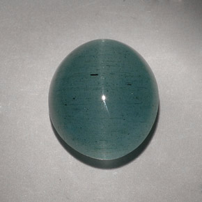 Cat's Eye Aquamarine طبيعي بلون أزرق-أخضر، وزن ‎11.55‎ قيراط، شكل شفاف، مقاس ‎15x12.8‎ مم