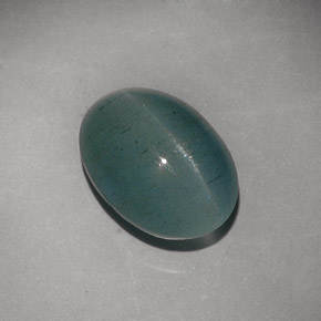 Cat's Eye Aquamarine طبيعي بلون أزرق-أخضر، وزن ‎6.79‎ قيراط، شكل شفاف، مقاس ‎13.4x9.8‎ مم