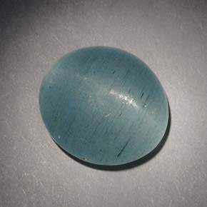 Cat's Eye Aquamarine طبيعي بلون أزرق-أخضر، وزن ‎7.21‎ قيراط، شكل بيضاوى، مقاس ‎13x11.7‎ مم