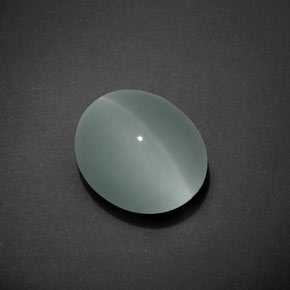 Cat's Eye Aquamarine طبيعي بلون أخضر-أزرق، وزن ‎7.17‎ قيراط، شكل بيضاوى، مقاس ‎12.8x10.9‎ مم