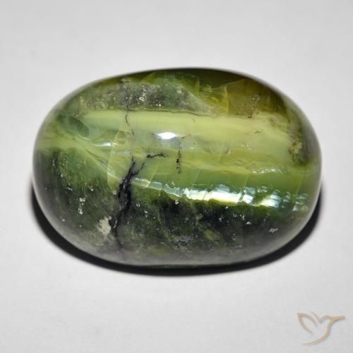 27.34ct طبيعي أخضر دافئ أوبال عين القط, بيضوي, غير شفاف
