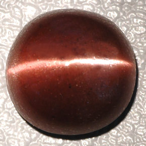 Cat's Eye Scapolite طبيعي بلون بني داكن، وزن ‎4.26‎ قيراط، شكل بيضاوى، مقاس ‎10.3x10.2‎ مم