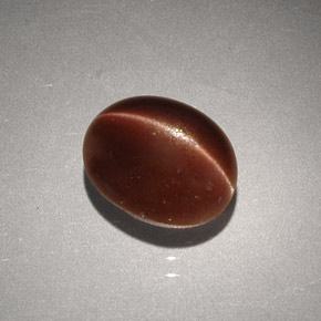 Cat's Eye Scapolite طبيعي بلون بني، وزن ‎2.56‎ قيراط، شكل بيضاوى، مقاس ‎9.1x7.3‎ مم