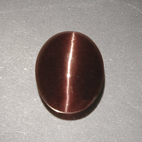 Cat's Eye Scapolite طبيعي بلون بني، وزن ‎2.32‎ قيراط، شكل بيضاوى، مقاس ‎9.7x7.9‎ مم