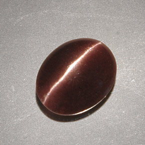 Cat's Eye Scapolite طبيعي بلون بني، وزن ‎2.32‎ قيراط، شكل بيضاوى، مقاس ‎9.7x7.9‎ مم