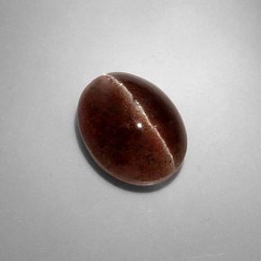 Cat's Eye Scapolite طبيعي بلون بني، وزن ‎8.31‎ قيراط، شكل بيضاوى، مقاس ‎13.4x10.3‎ مم