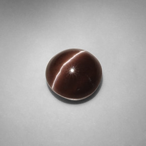 Cat's Eye Scapolite طبيعي بلون بني داكن، وزن ‎5.82‎ قيراط، شكل دائري، مقاس ‎10.58‎ مم