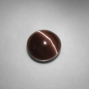 Cat's Eye Scapolite طبيعي بلون بني داكن، وزن ‎5.82‎ قيراط، شكل دائري، مقاس ‎10.58‎ مم