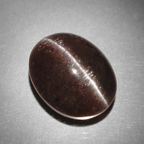 Cat's Eye Scapolite طبيعي بلون بني، وزن ‎9.31‎ قيراط، شكل بيضاوى، مقاس ‎13.4x10.7‎ مم
