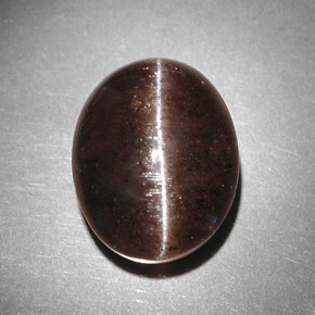 Cat's Eye Scapolite طبيعي بلون بني، وزن ‎9.31‎ قيراط، شكل بيضاوى، مقاس ‎13.4x10.7‎ مم