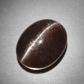 Cat's Eye Scapolite طبيعي بلون بني، وزن ‎9.31‎ قيراط، شكل بيضاوى، مقاس ‎13.4x10.7‎ مم