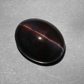 Cat's Eye Scapolite طبيعي بلون بني داكن، وزن ‎9.21‎ قيراط، شكل بيضاوى، مقاس ‎14.6x11.5‎ مم