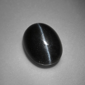 Cat's Eye Scapolite طبيعي بلون أسود، وزن ‎3.37‎ قيراط، شكل بيضاوى، مقاس ‎10.7x7.9‎ مم