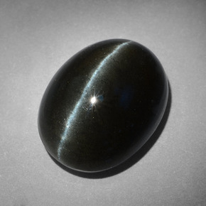 Cat's Eye Scapolite طبيعي بلون أسود، وزن ‎18.17‎ قيراط، شكل بيضاوى، مقاس ‎18.3x14‎ مم