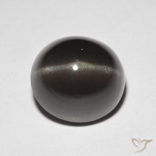 Cat's Eye Scapolite طبيعي بلون بنى مسود، وزن ‎3.32‎ قيراط، شكل بيضاوى، مقاس ‎8.9x8.3‎ مم