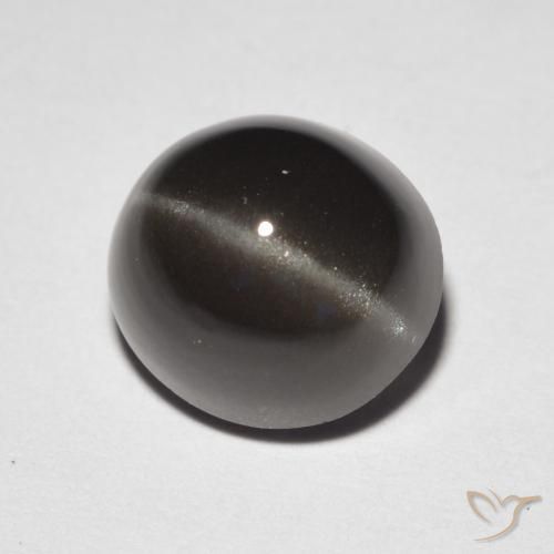 Cat's Eye Scapolite طبيعي بلون بنى مسود، وزن ‎3.32‎ قيراط، شكل بيضاوى، مقاس ‎8.9x8.3‎ مم