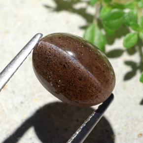 Cat's Eye Scapolite طبيعي بلون برتقالي بني عميق، وزن ‎4.55‎ قيراط، شكل بيضاوى، مقاس ‎10.7x7.9‎ مم