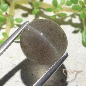 Cat's Eye Scapolite طبيعي بلون بنى فاتح-متوسط، وزن ‎3.94‎ قيراط، شكل بيضاوى، مقاس ‎9.6x9.2‎ مم