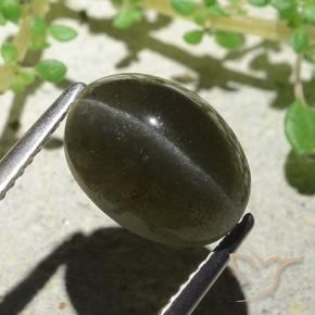 Cat's Eye Scapolite طبيعي بلون بني مخضر، وزن ‎4.66‎ قيراط، شكل بيضاوى، مقاس ‎11.1x8.3‎ مم
