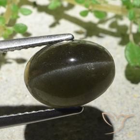 Cat's Eye Scapolite طبيعي بلون بني مخضر، وزن ‎4.66‎ قيراط، شكل بيضاوى، مقاس ‎11.1x8.3‎ مم